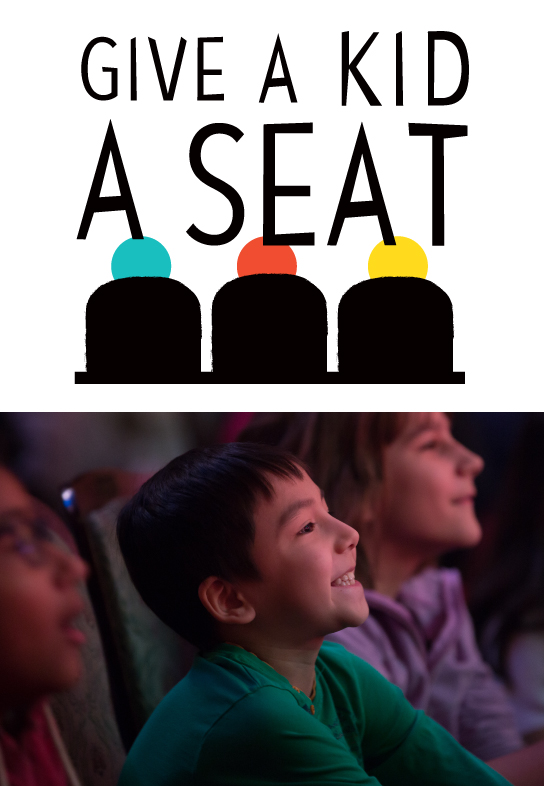 Give a Kid a Seat: Image of schoolkids enjoying a performance