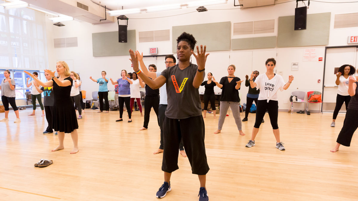 A New Victory Teaching Artist leads a group of teachers in a dance-focused Professional Development workshop.
