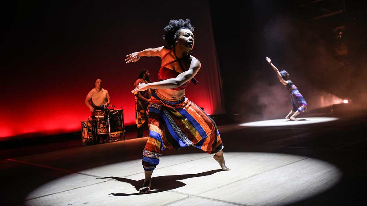 A dancer in a scene from Step Afrika!'s Drumfolk
