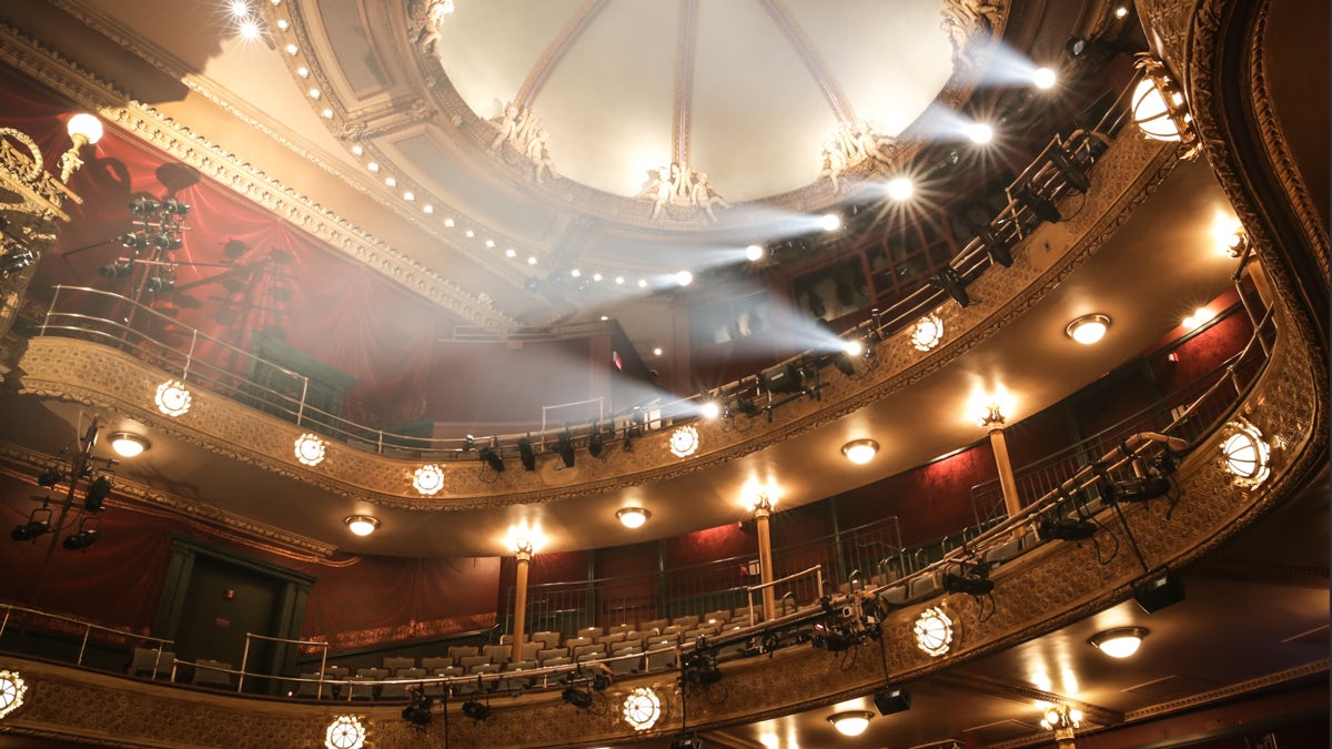 Interior of the New Victory Theater with stage lights in balcony