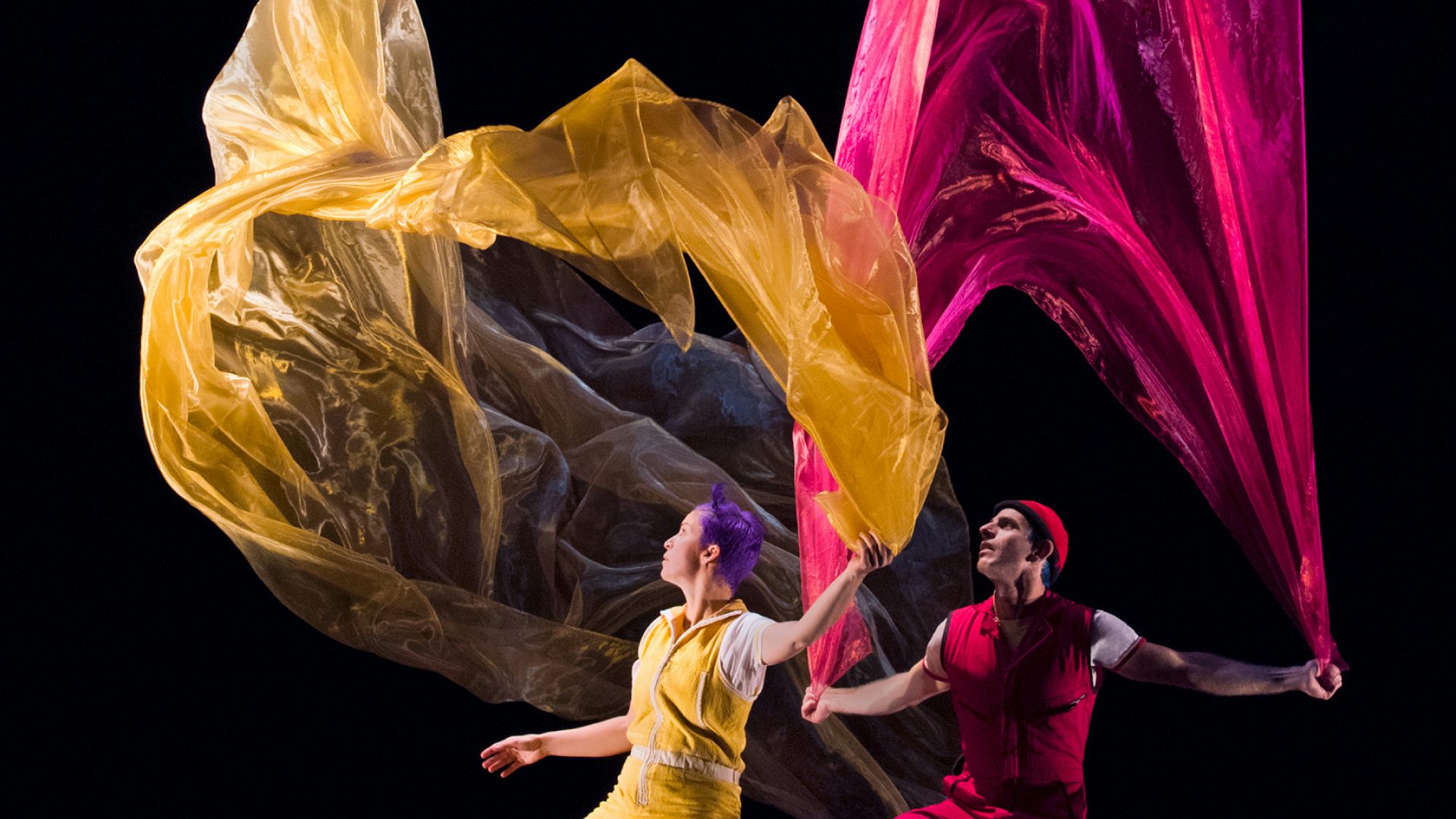 Acrobuffos with billowing fabric in a scene from Air Play.