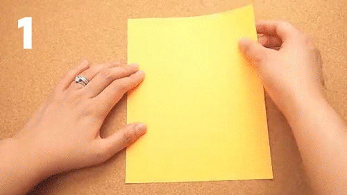 Animation of a sheet of paper folded and cut into square