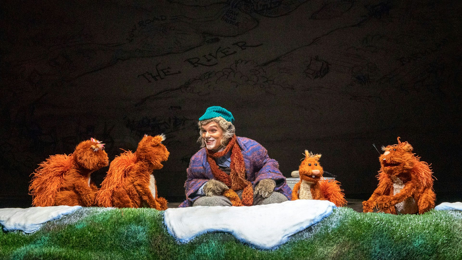 Colin Trudell as Emmet Otter with squirrel puppets.