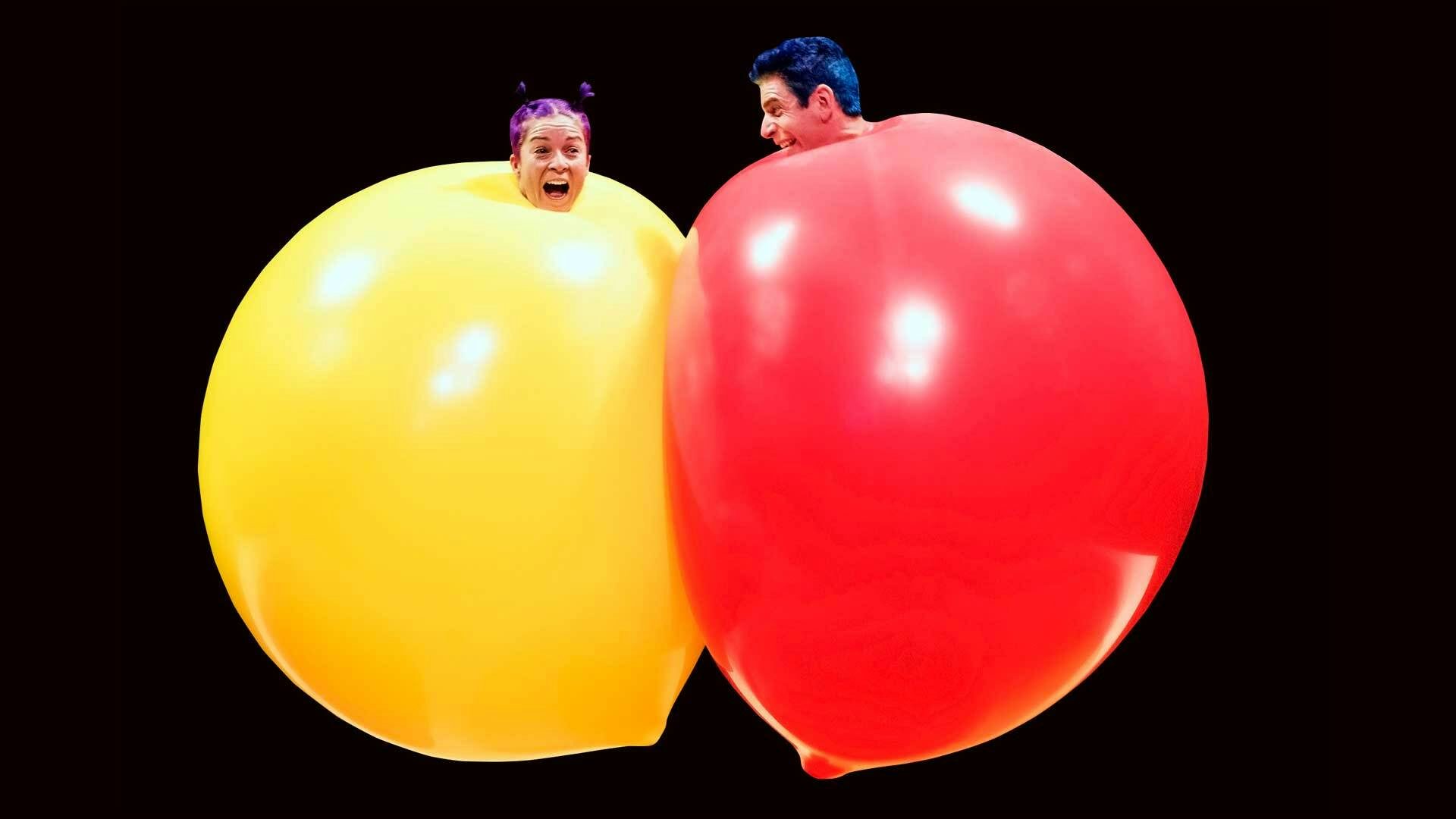 Acrobuffos inside giant balloons.