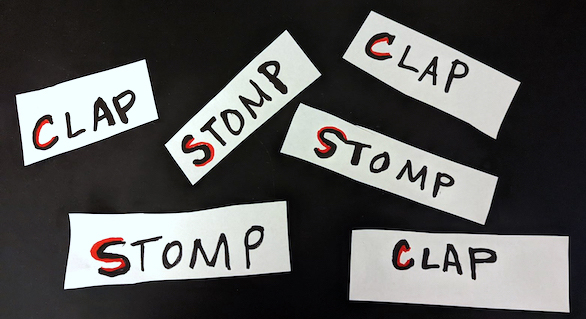 Slips of paper featuring the words "clap" and "stomp"