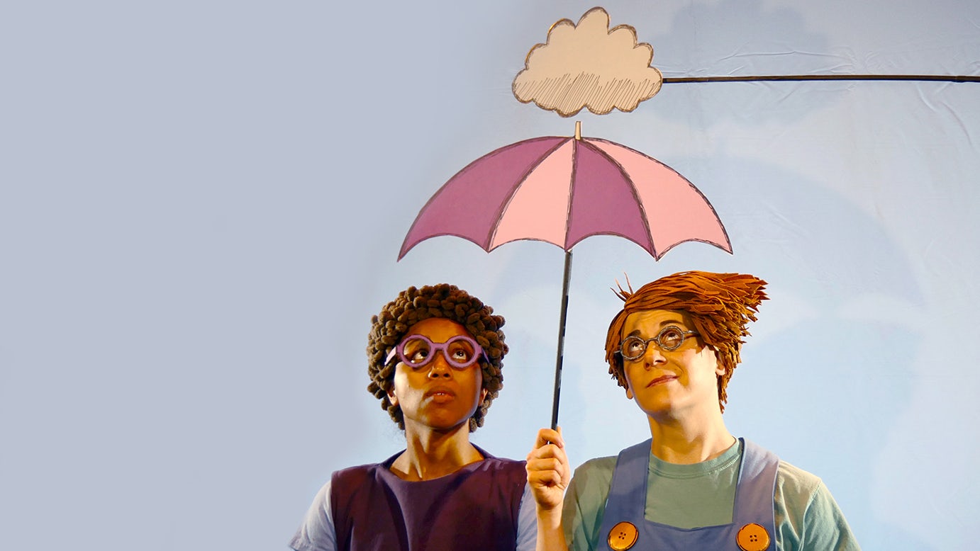 Actors playing Kerry and Leonardo hold a stylized paper umbrella underneath a paper raincloud.