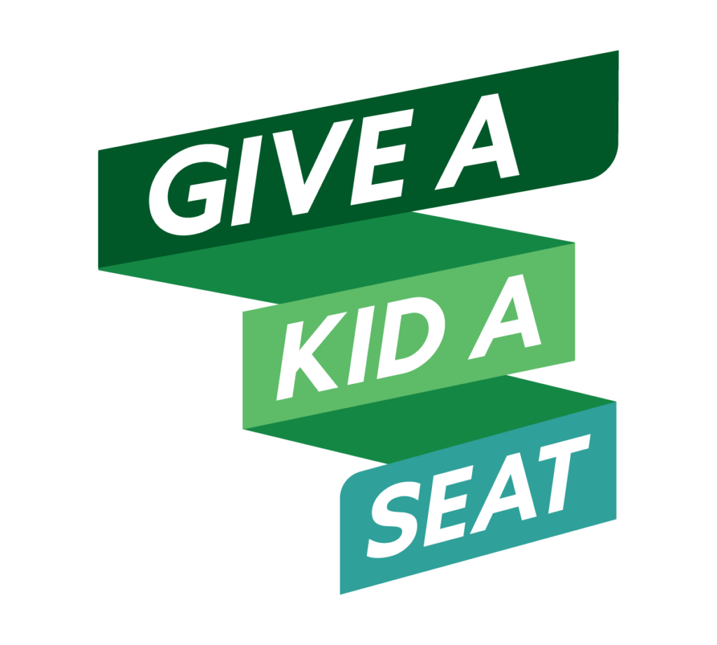 A green banner that reads, "Give A Kid A Seat."