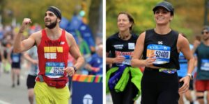 Two NYC Marathon participants from a previous Team New 42 cheer as they run past