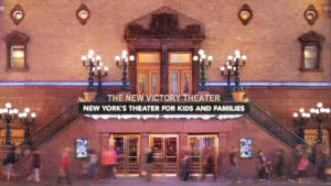 Entrance and fully light theater marquee of the New Victory