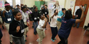 Children dancing in a classroom