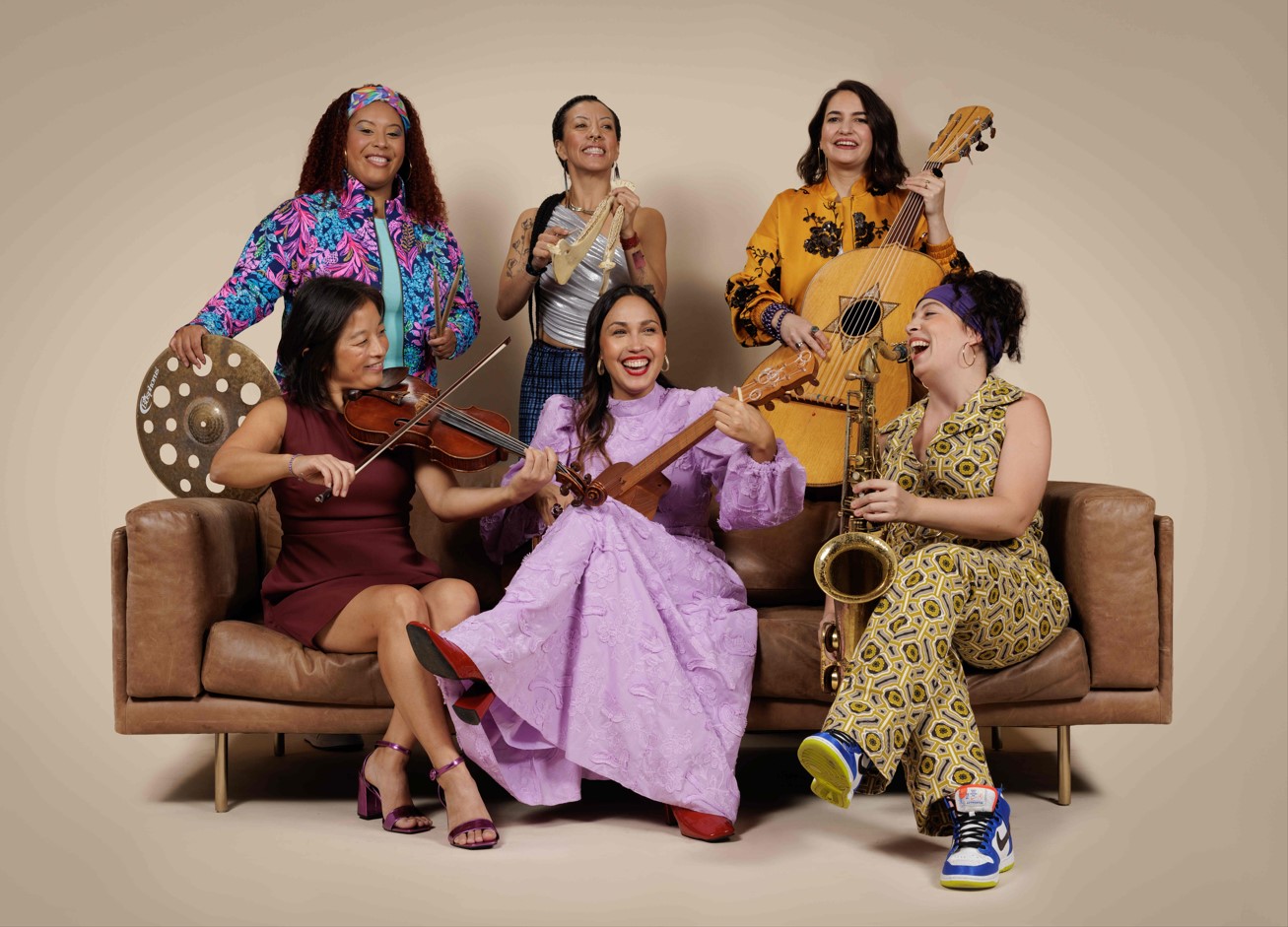 Photo of Sonia De Los Santos and her all-female band from Musica