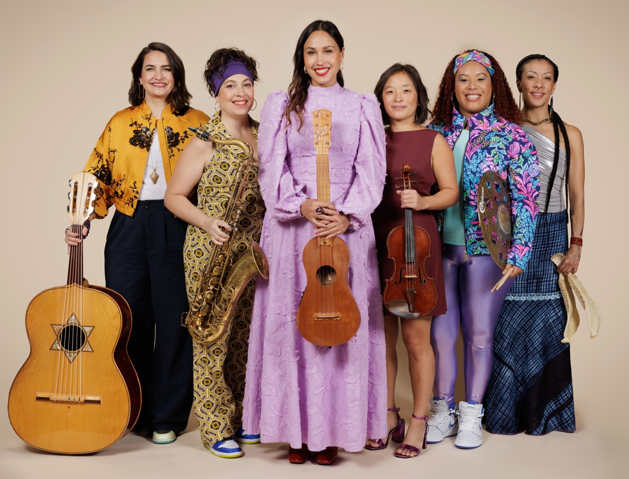 A photo of Sonia and her all-female band from Musica