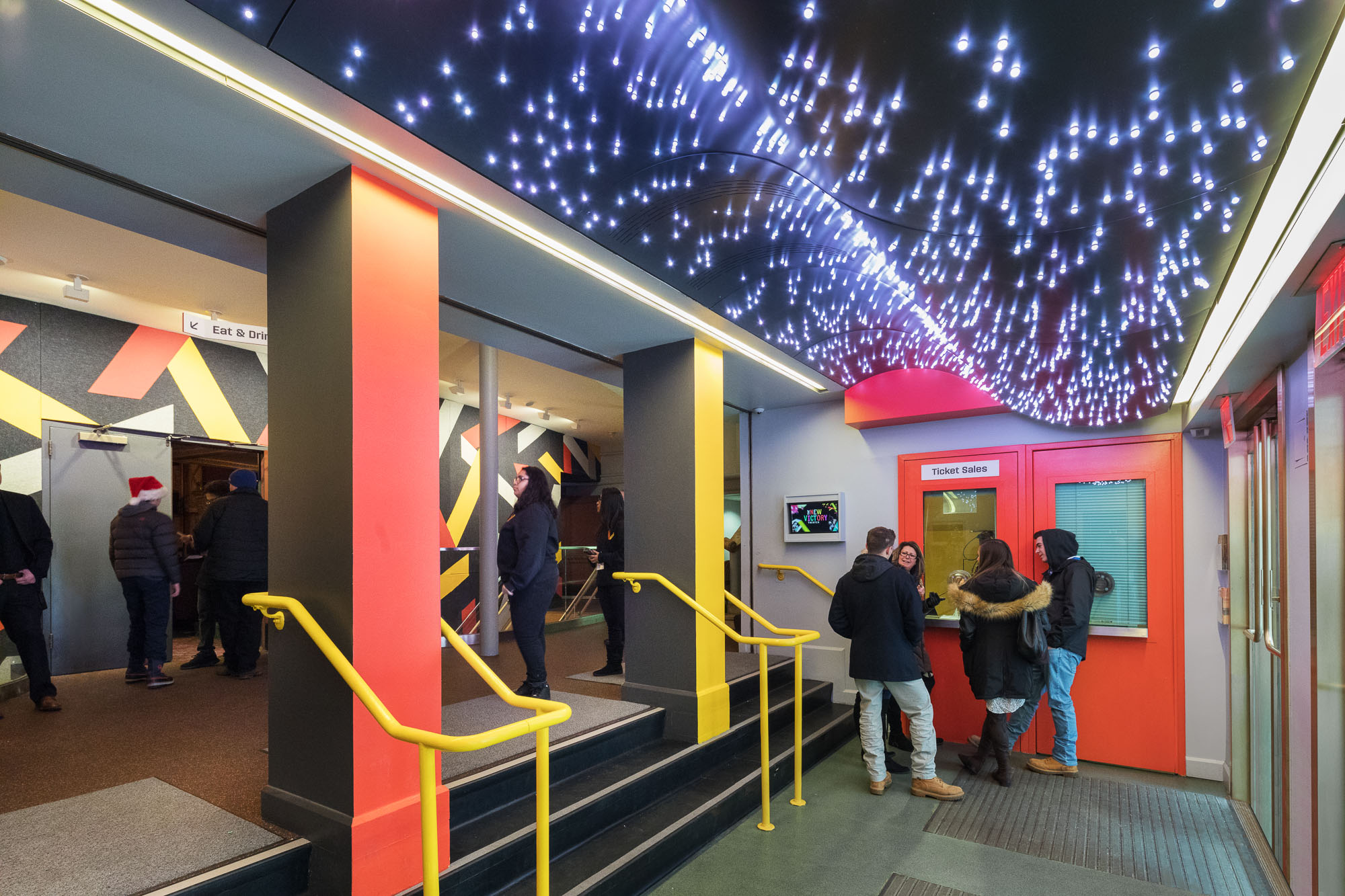 The box office entrance to the New Victory Theater, with the twinkle lights on the ceiling illuminated