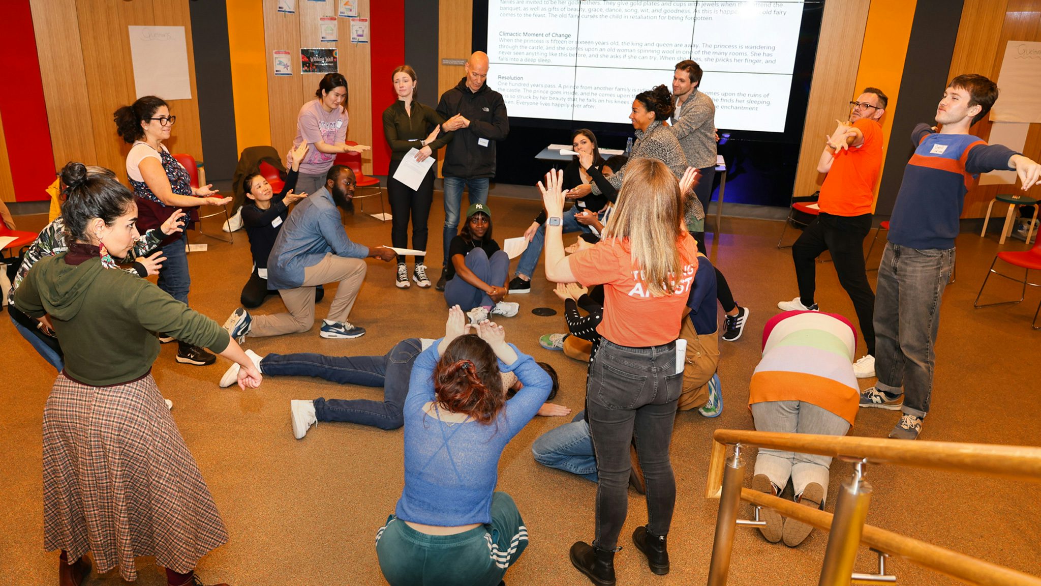 Teaching artist and educators during a learning session in the lower lobby of the new victory theater.