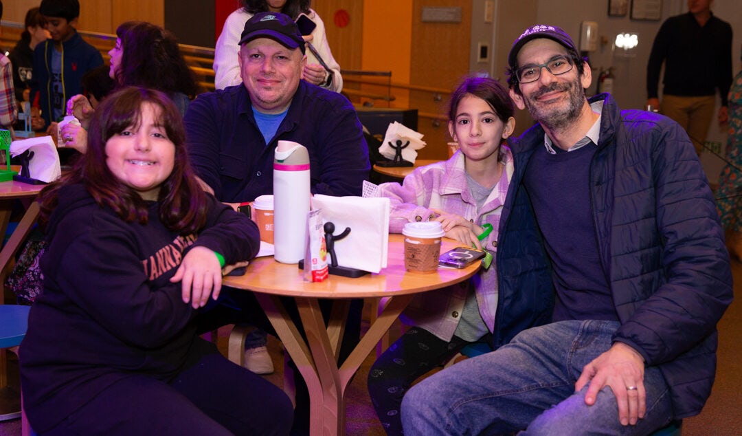 A family sitting around a table.