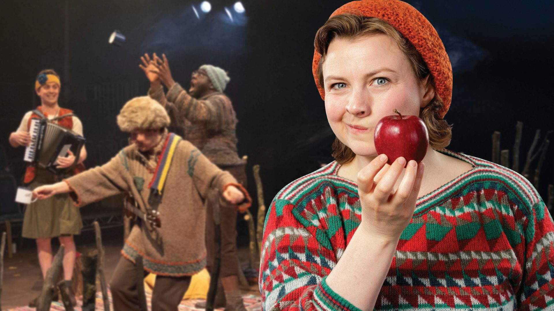 A woman wearing an orange hat and colorful shirt holds a red apple up to her face, and in the background to the left, three actors dance and play instruments.